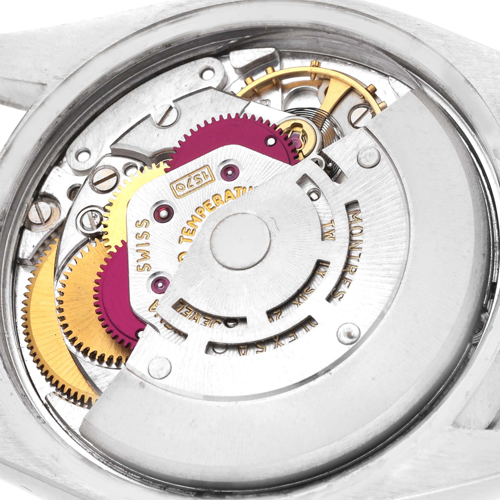 The image shows the internal mechanism and gears of a Rolex Date 1500 Men
s Stainless Steel Black Dial 1500 Men
s Stainless Steel Black Dial watch, viewed from the back.