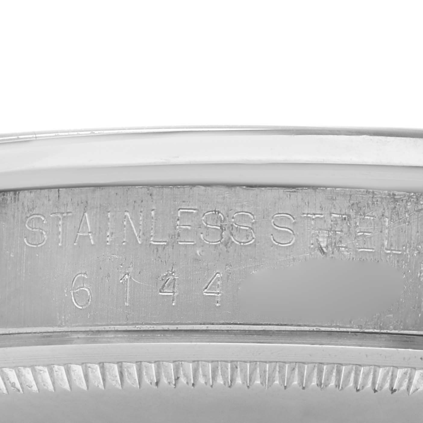 The image shows the inside of the casing of a Rolex Date 1500 Men
s Stainless Steel Black Dial 1500 Men
s Stainless Steel Black Dial watch with the model number engraved.