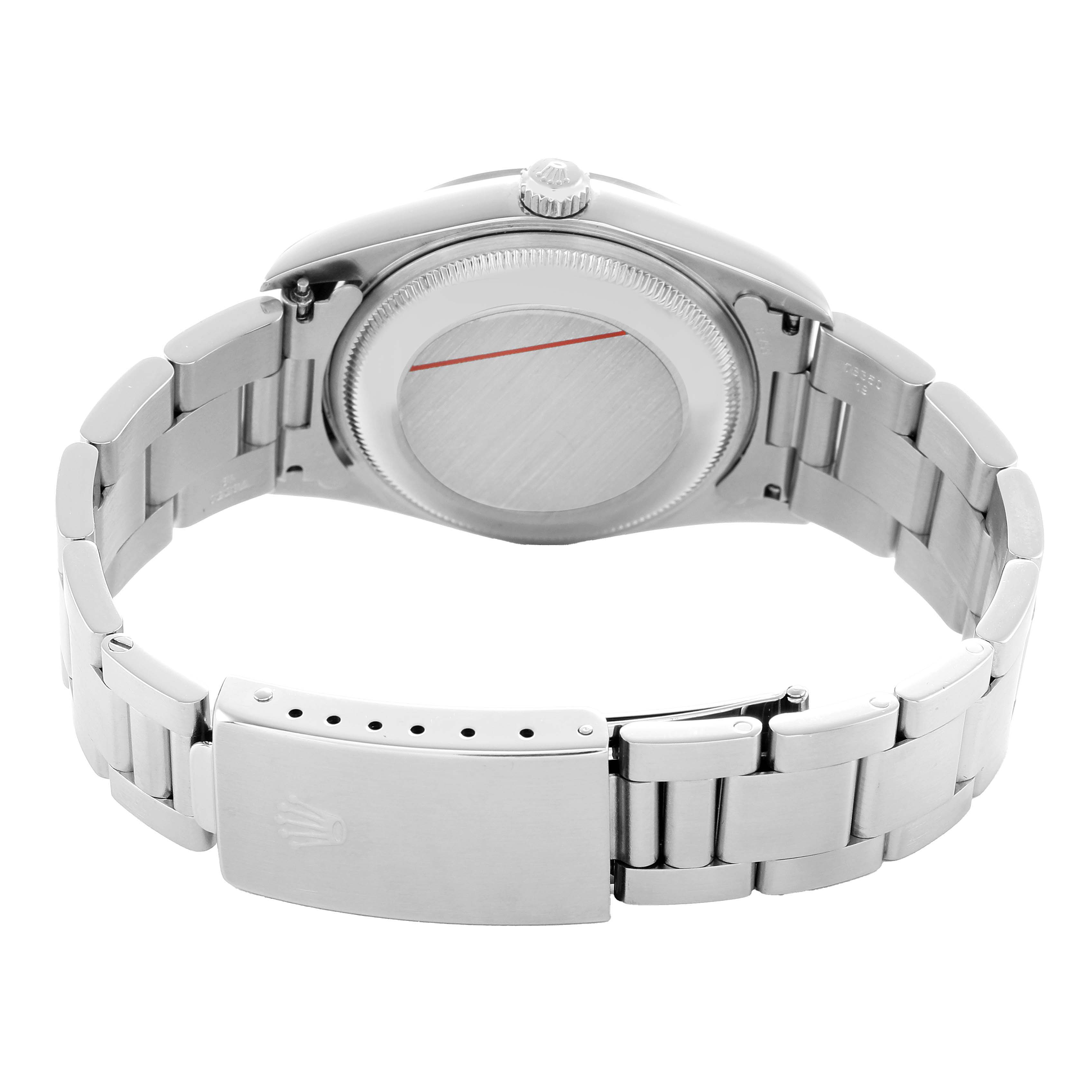 The Rolex Date 15200 Men's Stainless Steel Pink Dial watch is shown from the back, highlighting the case back and bracelet with the clasp open.