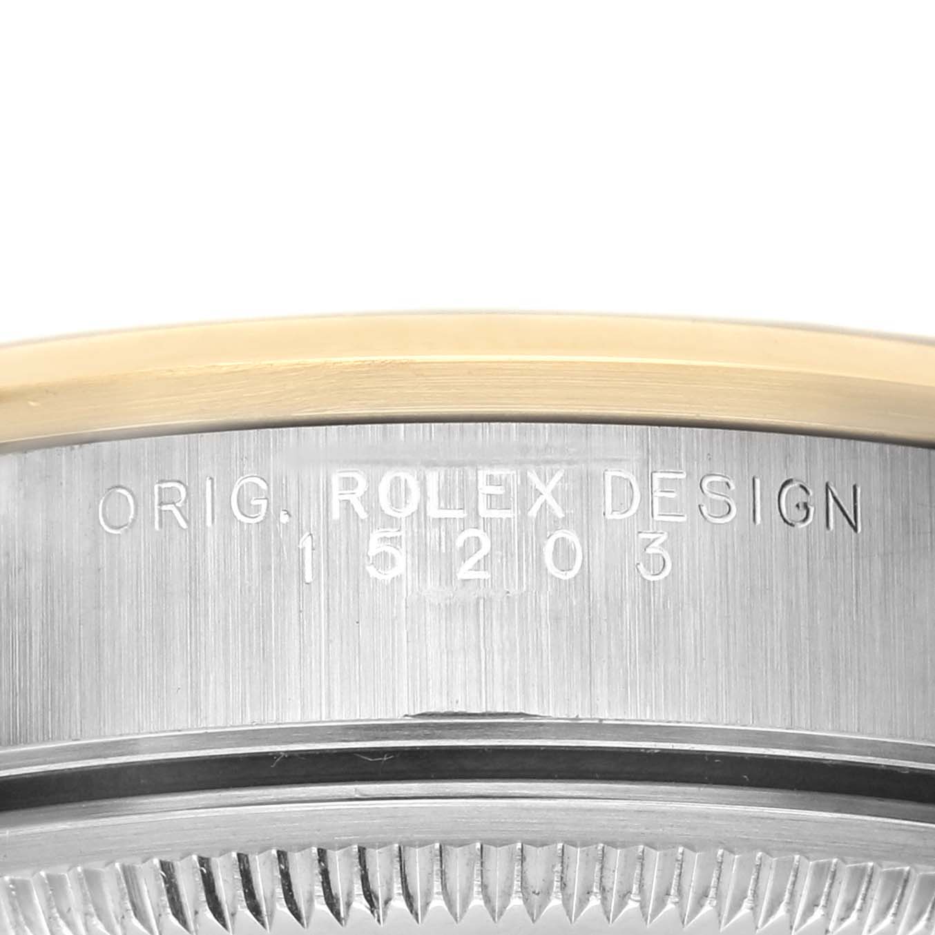 The image shows the side engraving of a Rolex Date 15203 Men's Steel and Gold (two tone) Grey Dial 15203 Men's Steel and Gold (two tone) Grey Dial model, highlighting the case reference number.
