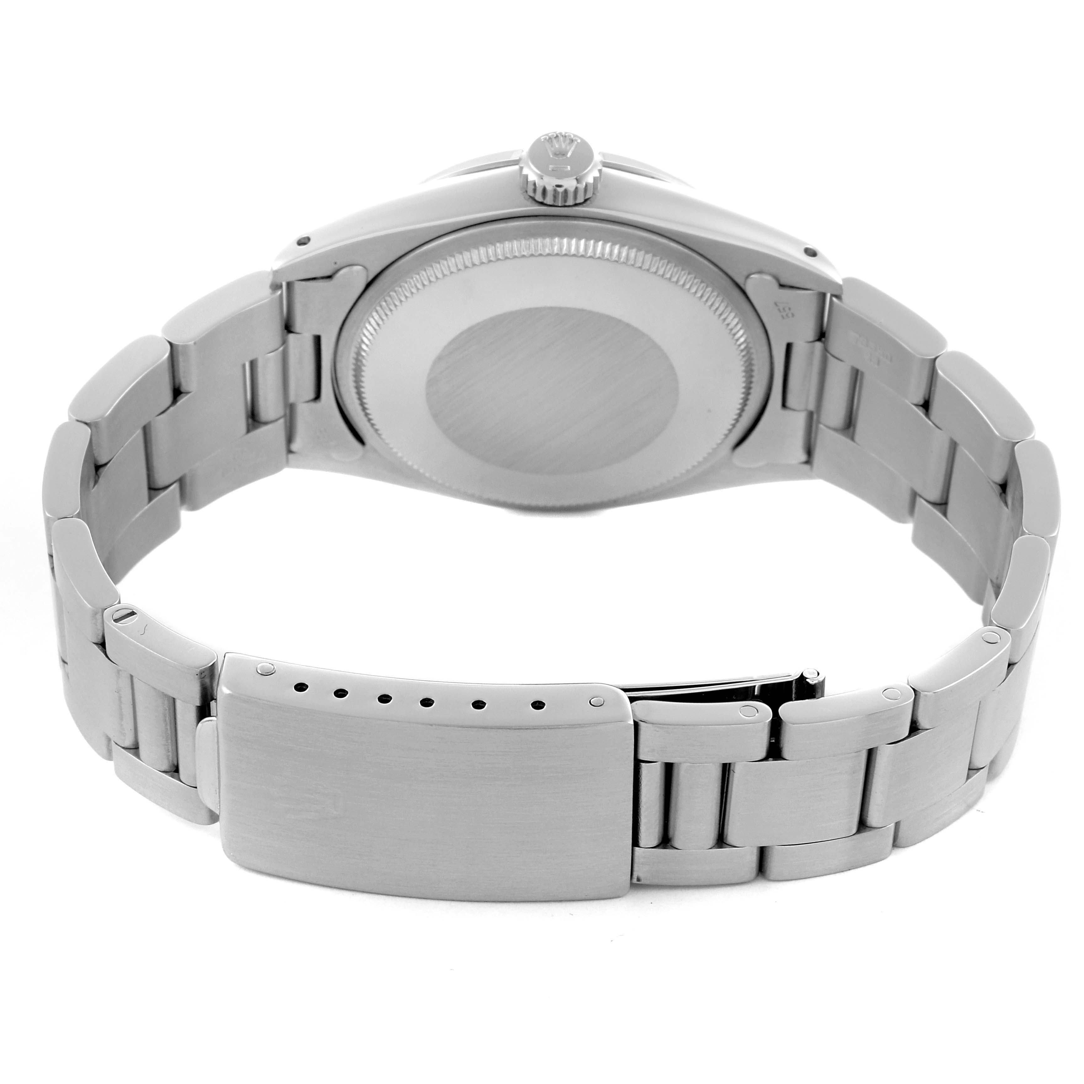 The image shows the back of the Rolex Date 66579 Men's Stainless Steel White Dial 66579 Men's Stainless Steel White Dial watch, highlighting the case back and bracelet clasp.