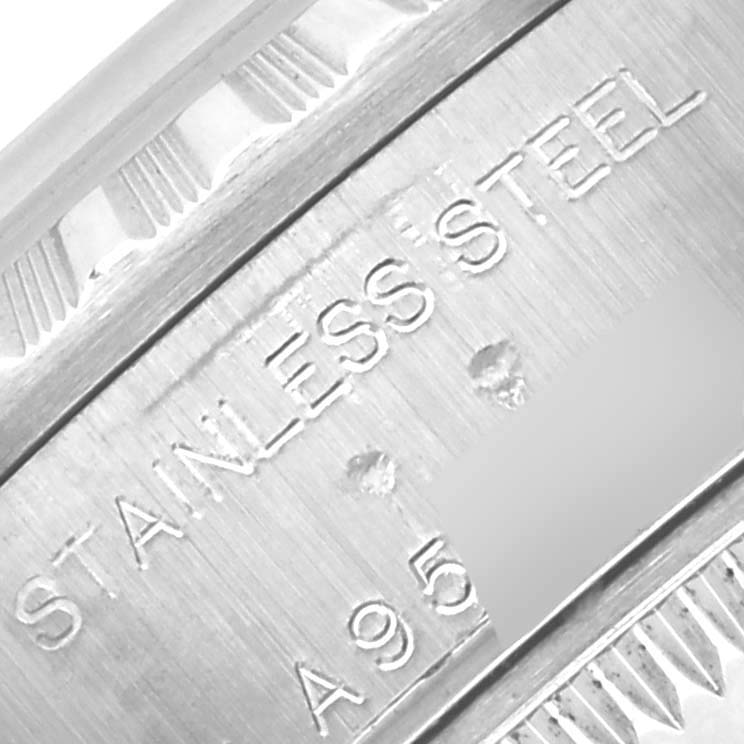 The image shows a close-up of the outer case side or rim with "STAINLESS STEEL" engraved on the Rolex Date 79240 Women
s Stainless Steel White Dial 79240 Women
s Stainless Steel White Dial model.