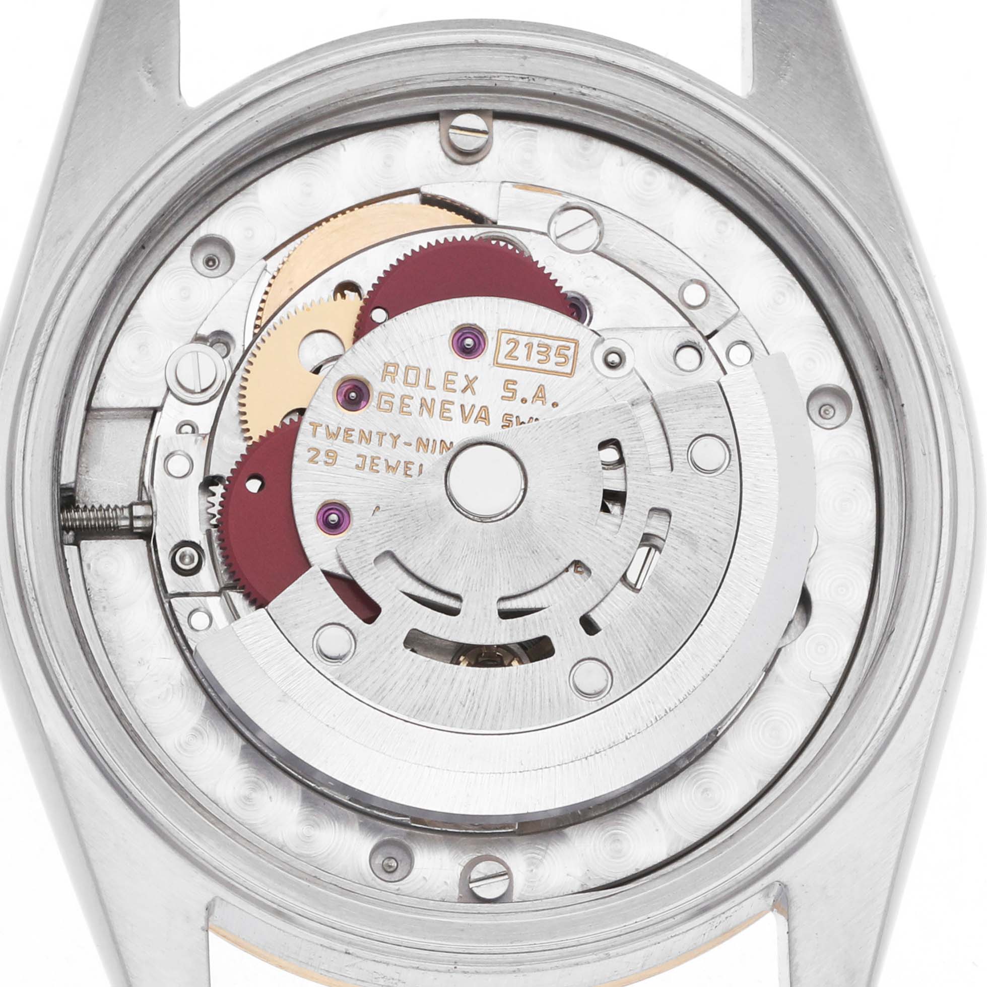 The image shows the back view of a Rolex Mid-Size 68273 Women's Steel and Gold (two tone) Champagne Dial model, featuring its internal movement mechanism.