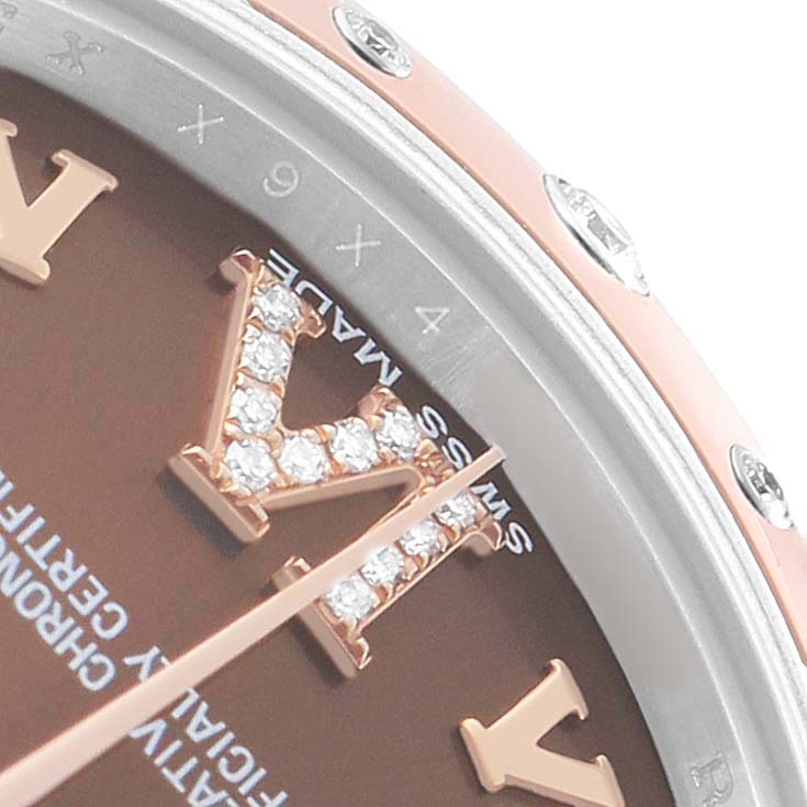 The image shows a close-up of a Rolex Mid-Size 178341 Women's Steel and Gold (two tone) Brown Dial watch focusing on the dial, bezel, and diamond-encrusted Roman numeral.