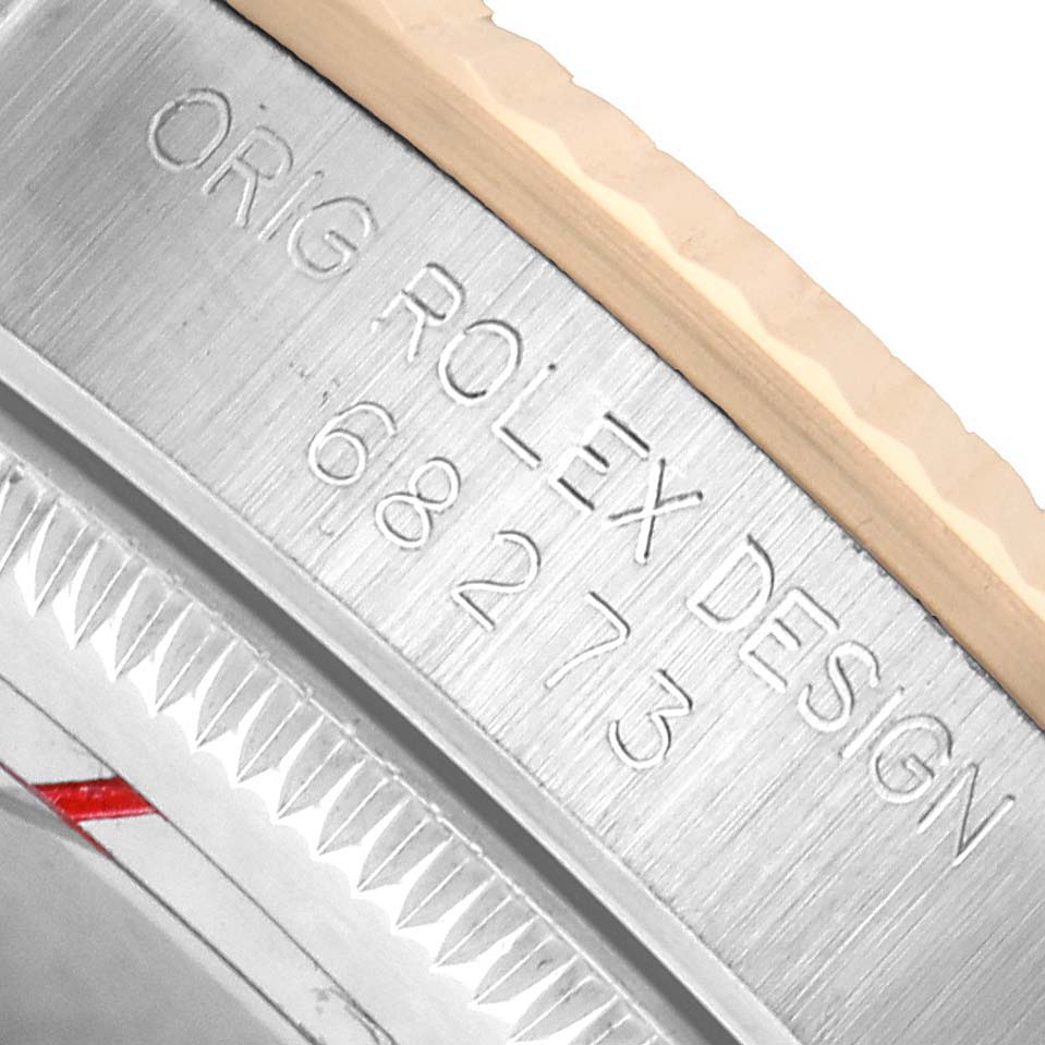 The image shows the engraved serial number on the side of a mid-size Rolex watch case.