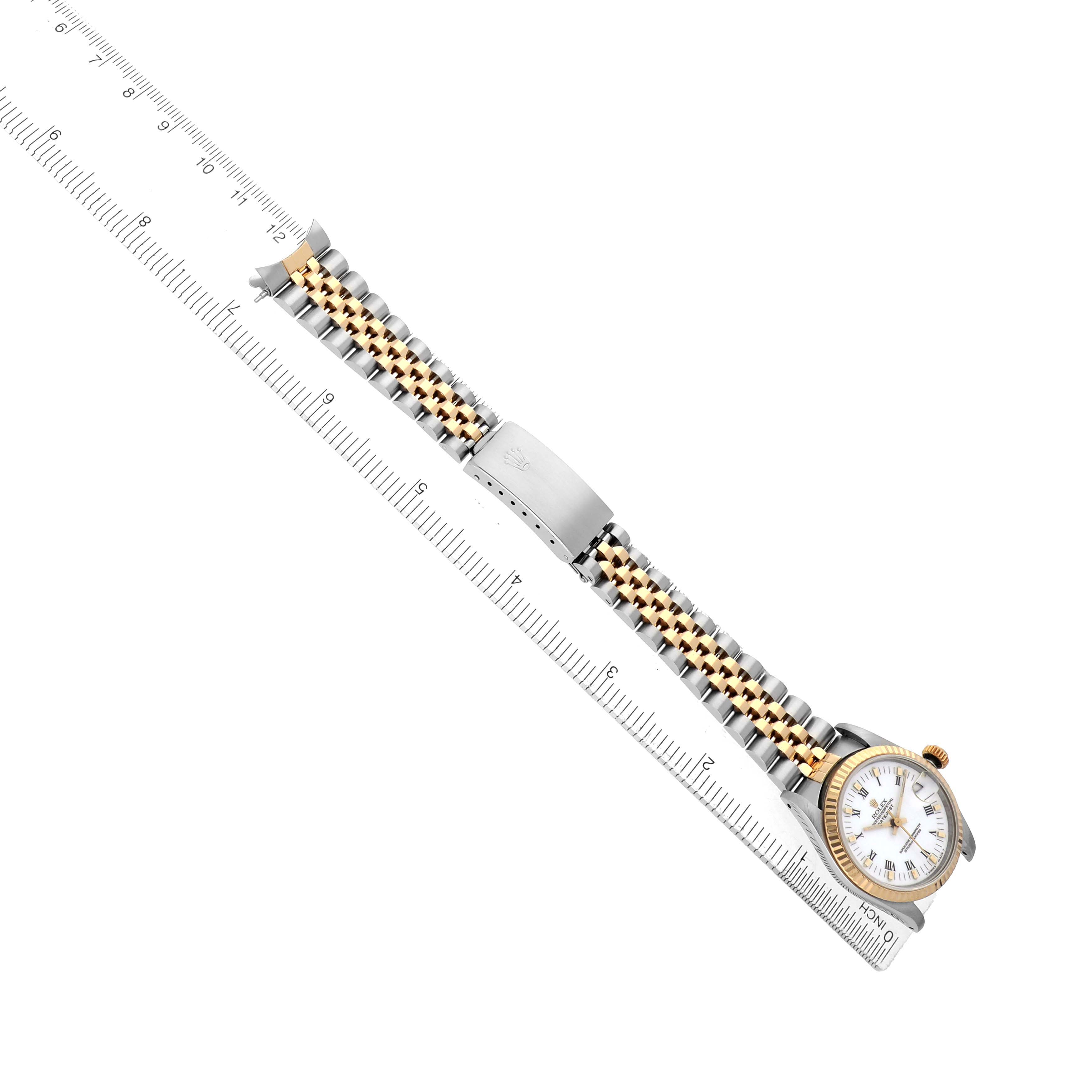 The image shows a Rolex Mid-Size 68273 Women's Steel and Gold (two tone) White Dial watch at an angled top-down view, highlighting the case, bezel, dial, and metal bracelet.
