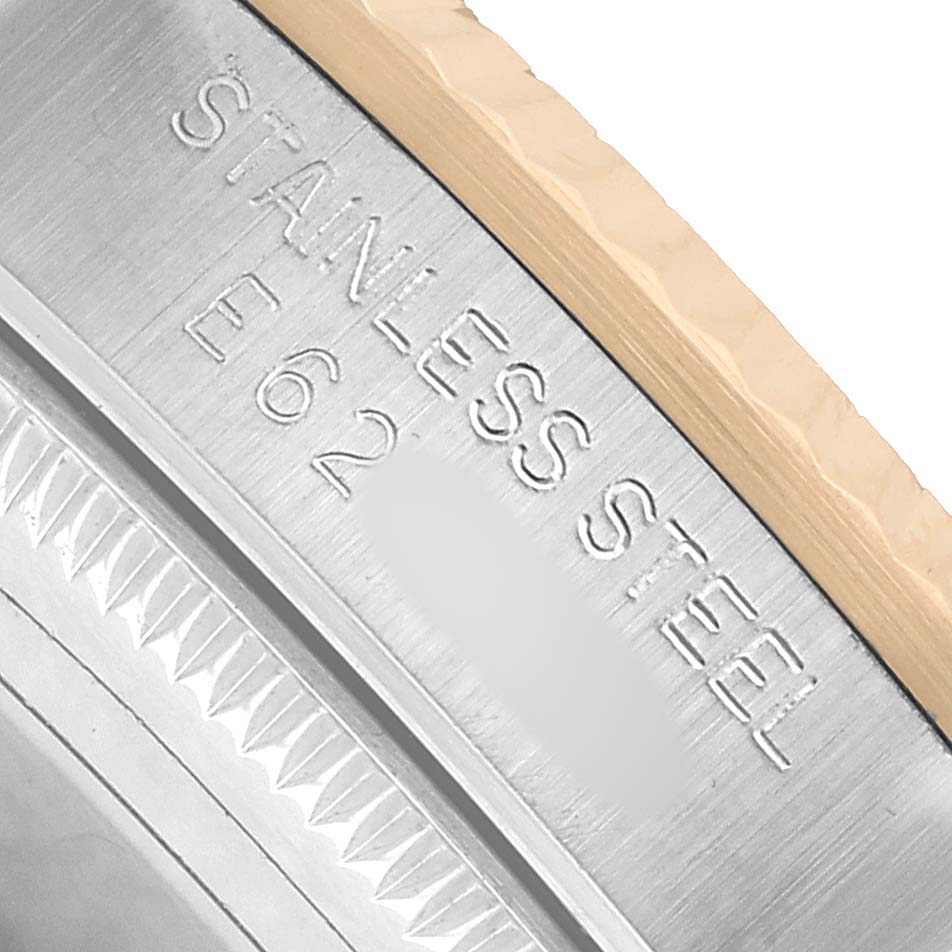 This close-up image of the Rolex Mid-Size 68273 Women's Steel and Gold (two tone) White Dial model shows the engraved "STAINLESS STEEL" text on the case back edge.