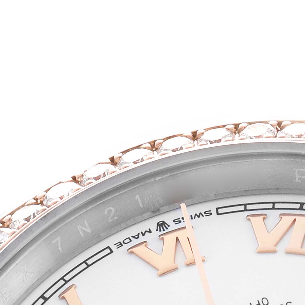 The image shows a partial view of a Rolex Datejust 126281 Men's Steel and Gold (two tone) White Dial watch, highlighting the diamond bezel and partial dial with Roman numerals.