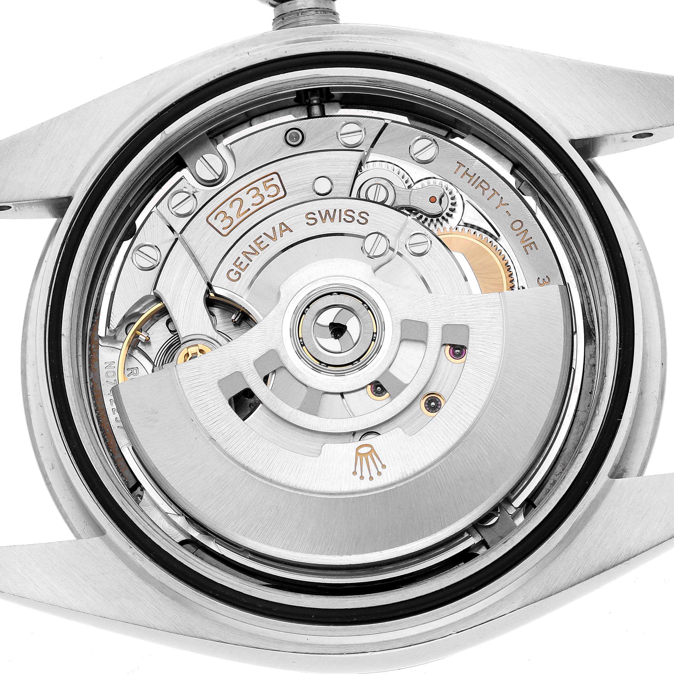 The image shows the movement of a Rolex Datejust 41 126334 Men's Stainless Steel Grey Dial, highlighting the rotor and intricate mechanisms from a top-down angle.