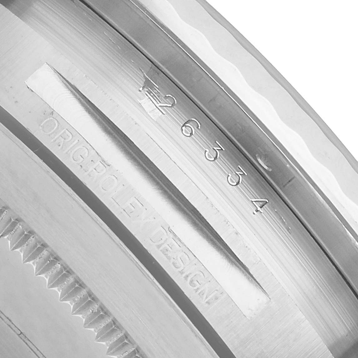 The image shows the inner bezel engraving of a Rolex Datejust 41 126334 Men's Stainless Steel Grey Dial, highlighting the serial number and "ROLEX DESIGN".