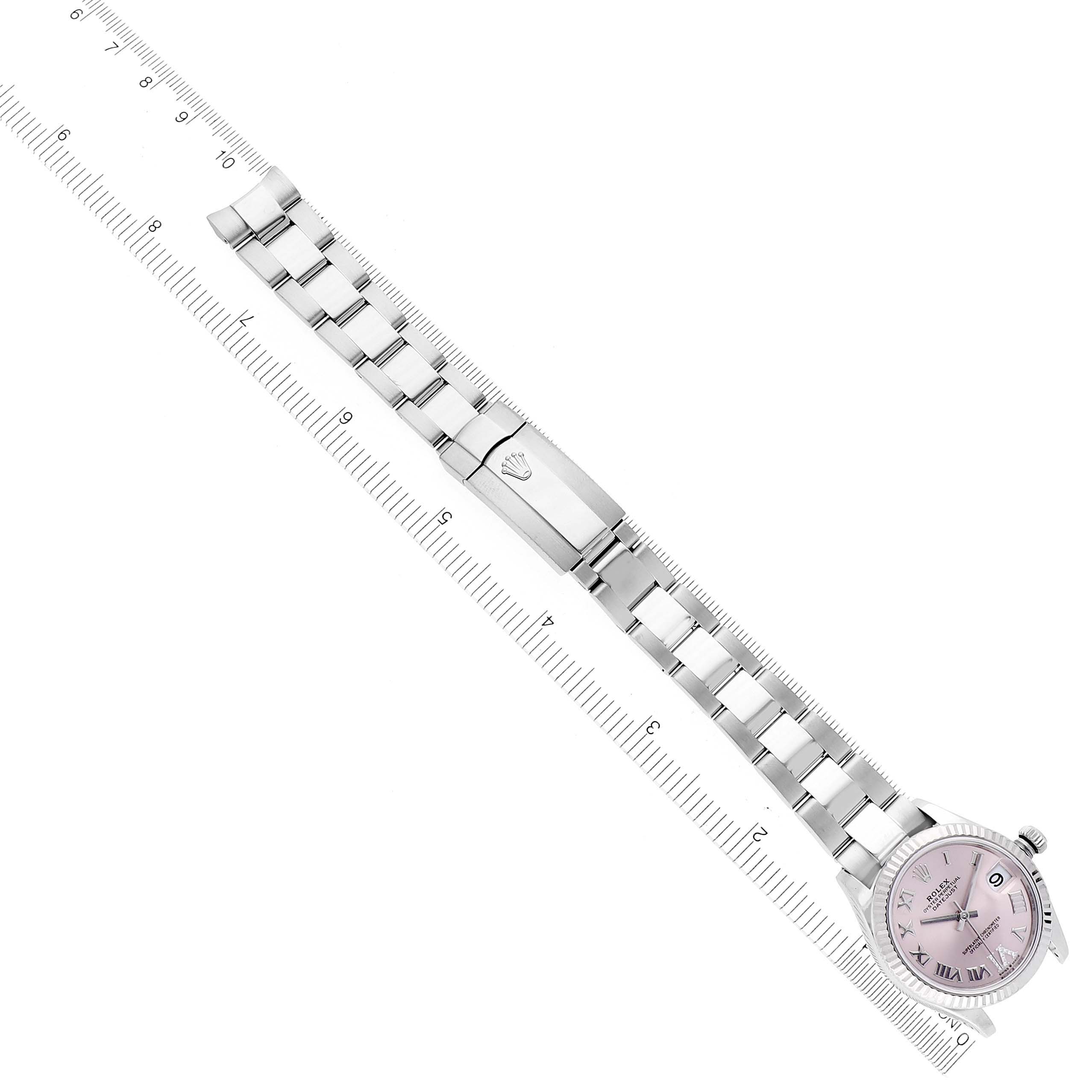 The image shows a Rolex Mid-Size 278274 Women's Stainless Steel Pink Dial 278274 Women's Stainless Steel Pink Dial watch laid flat, highlighting the bracelet and clasp with a measurement scale beside it.