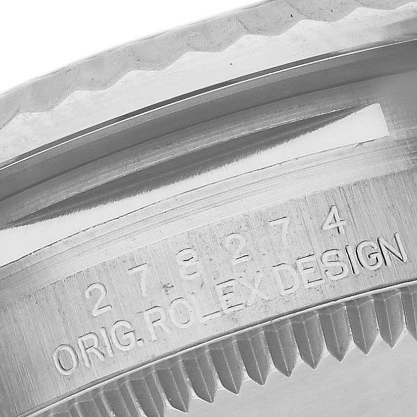 The image shows a close-up of the case edge and serial engraving on the Rolex Mid-Size 278274 Women's Stainless Steel Pink Dial 278274 Women's Stainless Steel Pink Dial watch.