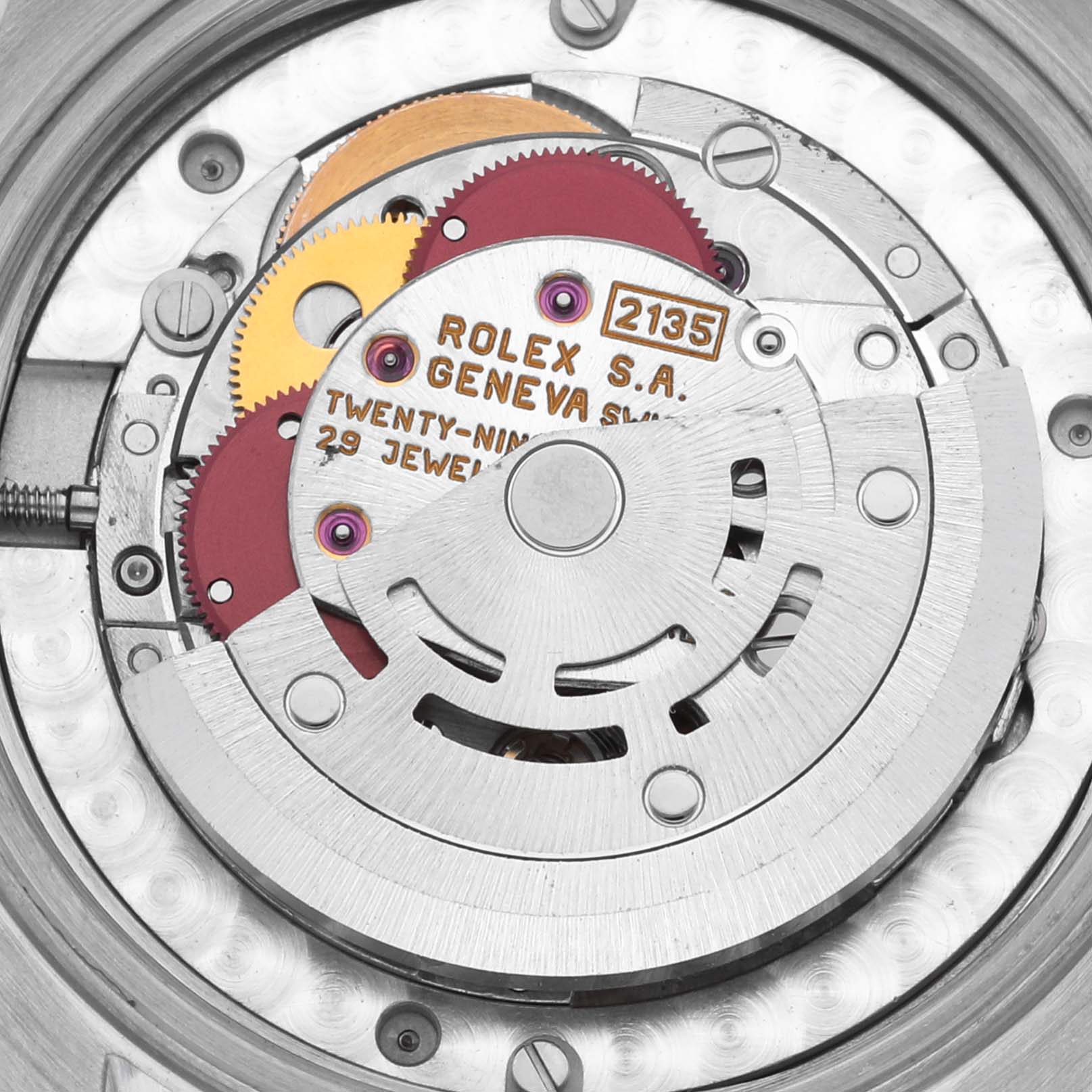 The image shows the internal movement of a Rolex Mid-Size 68273 Women's Steel and Gold (two tone) Red Dial 68273 Women's Steel and Gold (two tone) Red Dial watch, highlighting gears and rotor from a top-down angle.