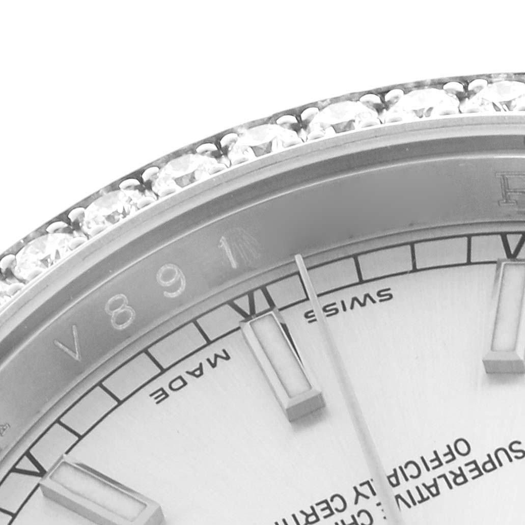 The image shows a close-up of the Rolex Datejust 116244 Men
s Stainless Steel Silver Dial 116244 Men
s Stainless Steel Silver Dial face, highlighting the bezel with diamonds and part of the dial.