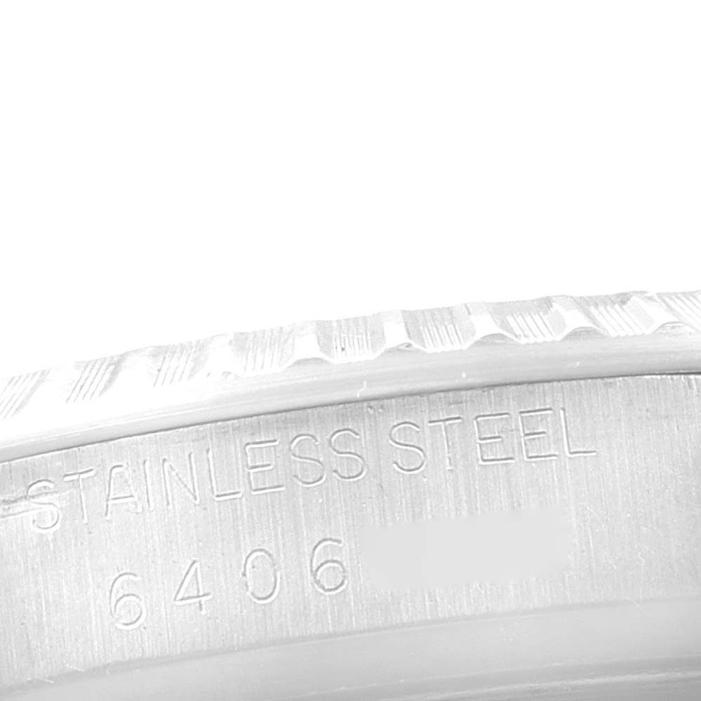 This image shows the side engraving on the stainless steel case of a Rolex Vintage Collection 16030 Men's Stainless Steel Silver Dial 16030 Men's Stainless Steel Silver Dial model with the model number 6406.