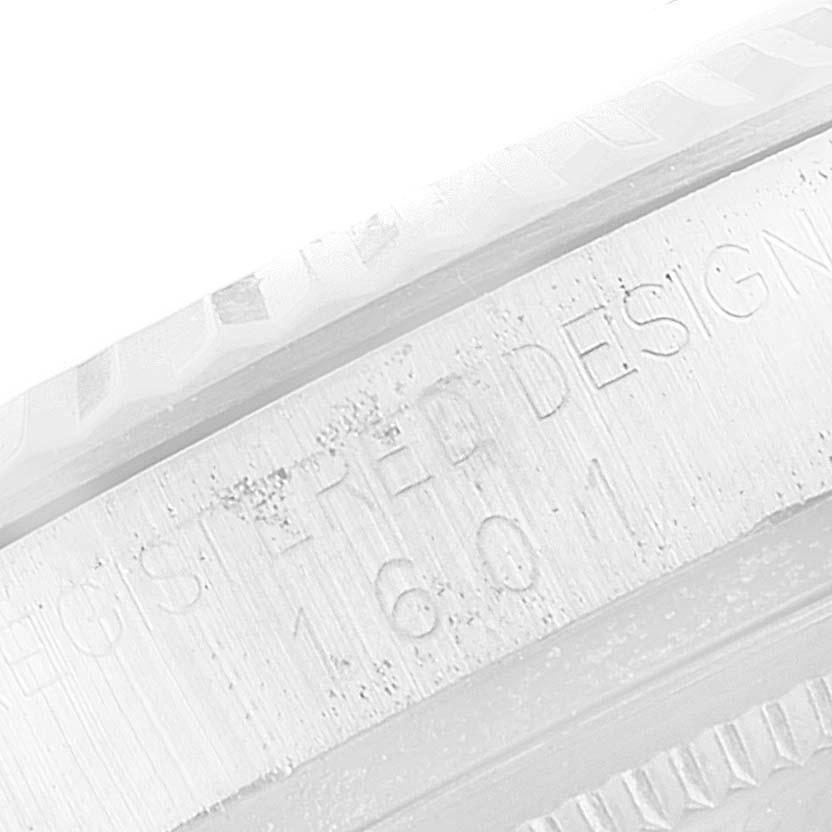 The image shows a close-up of the side of the bezel and engraved serial numbers of a Vintage Collection model by Rolex.