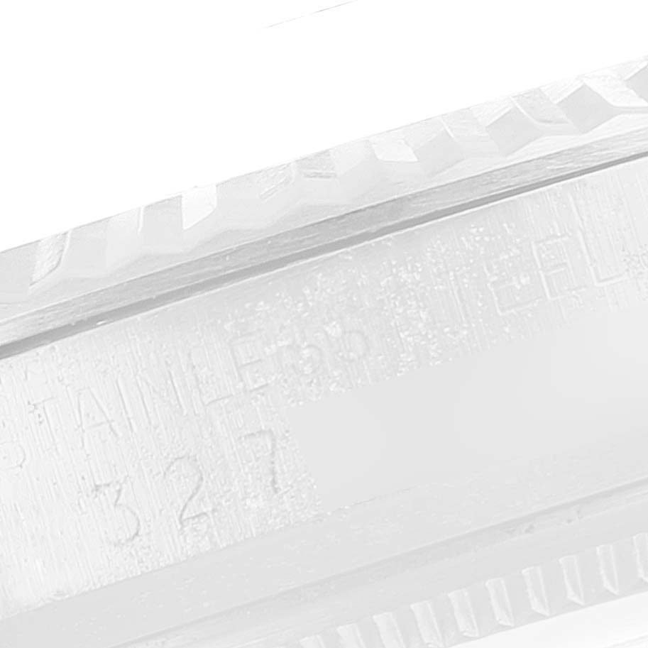 This image shows a close-up of the side of the bezel and engraved details on the Rolex Vintage Collection 1601 Men's Stainless Steel Blue Dial 1601 Men's Stainless Steel Blue Dial model.