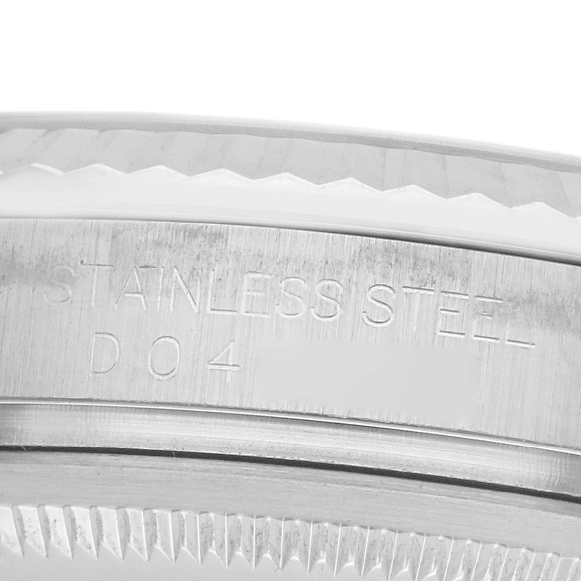 The image shows a close-up side view of the Rolex Datejust 116234 Men's Stainless Steel Silver Dial's stainless steel bezel, engraved with text.