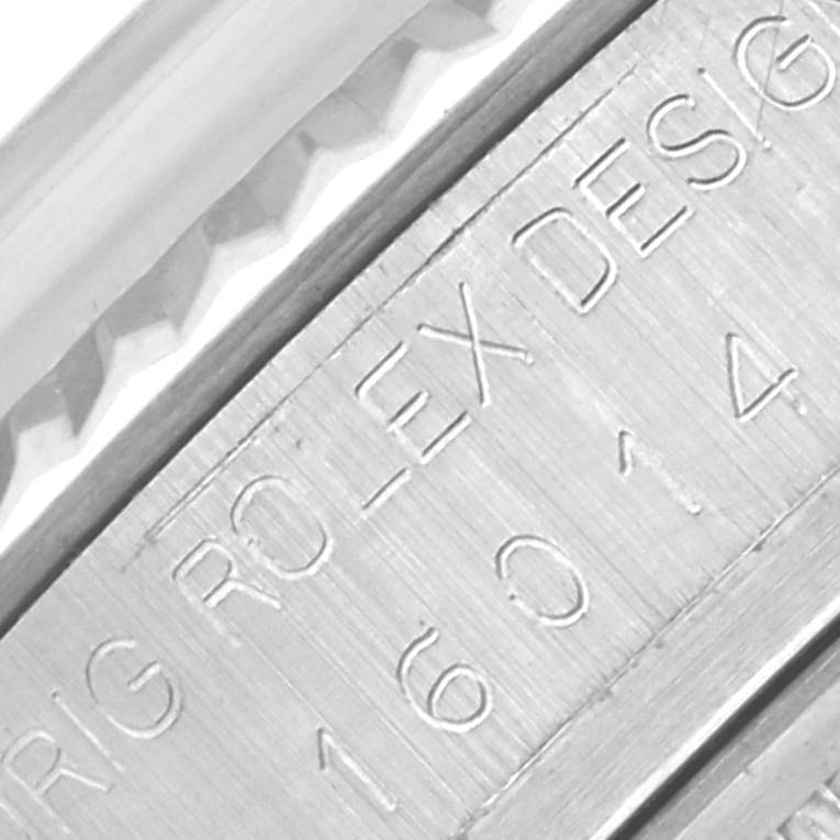 The image shows a close-up of the inner bezel engraving on a Rolex Datejust 16014 Men
s Stainless Steel Silver Dial 16014 Men
s Stainless Steel Silver Dial watch.
