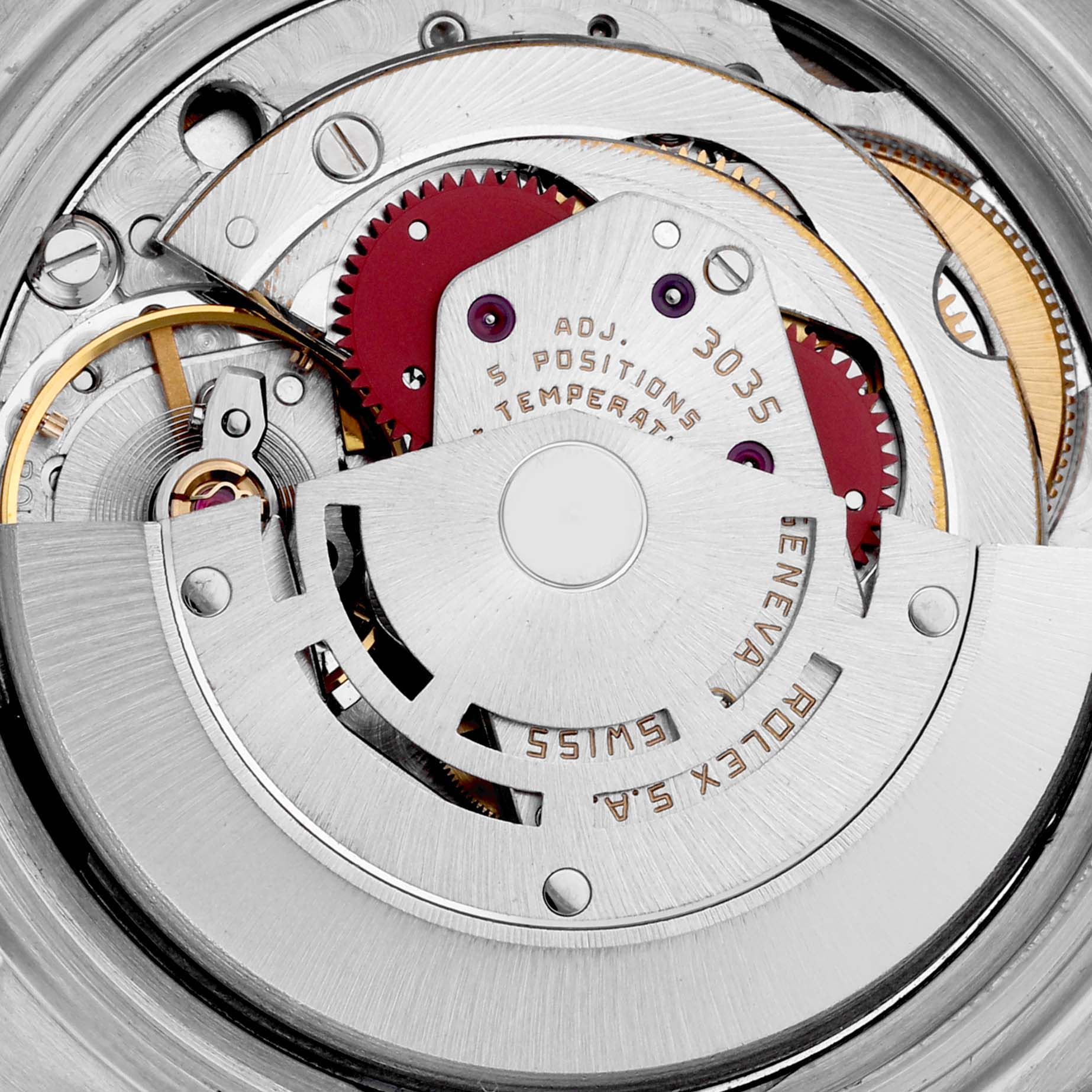 The image shows a close-up of the Rolex Datejust 16014 Men
s Stainless Steel Silver Dial 16014 Men
s Stainless Steel Silver Dial movement from an overhead angle, highlighting its intricate mechanics.