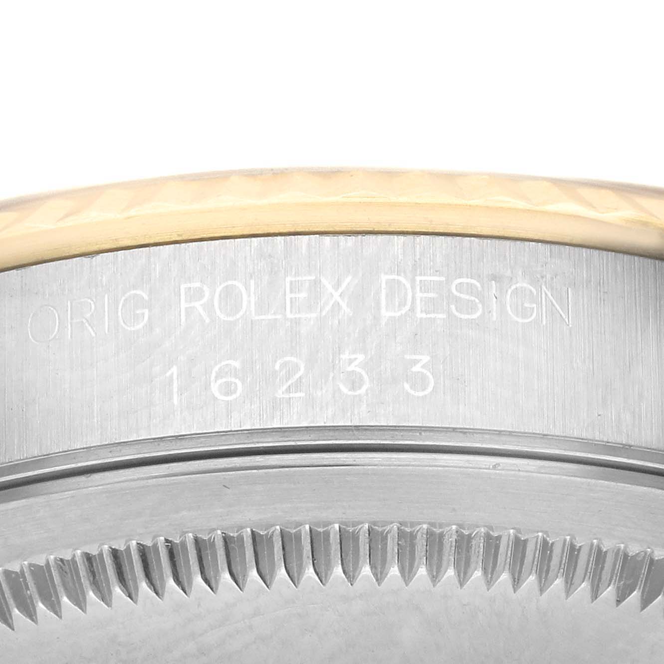 The image shows a close-up of the side of a Rolex Datejust 16233 Men's Steel and Gold (two tone) Champagne Dial 16233 Men's Steel and Gold (two tone) Champagne Dial watch case, highlighting the engraved model number.