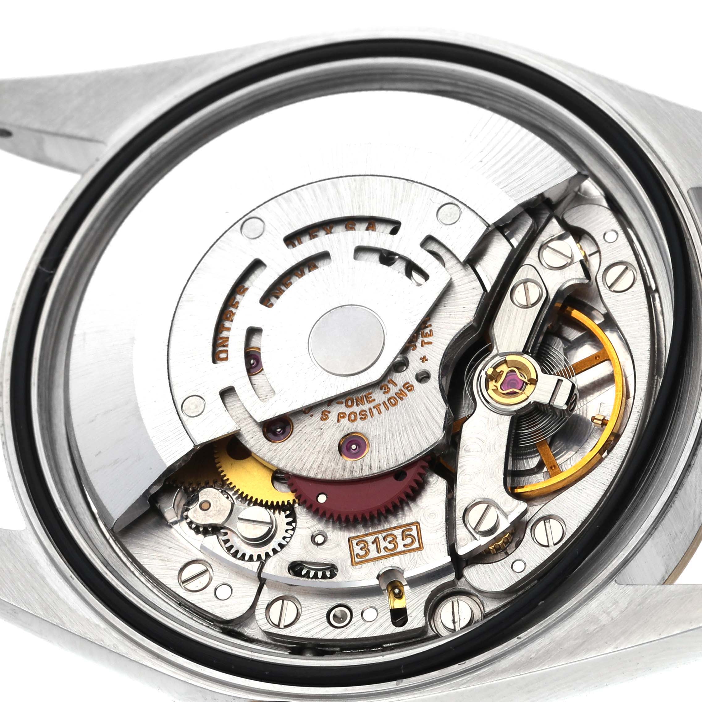 The image shows the inner mechanism of a Rolex Datejust 16233 Men's Steel and Gold (two tone) Champagne Dial 16233 Men's Steel and Gold (two tone) Champagne Dial watch movement, viewed from the back.