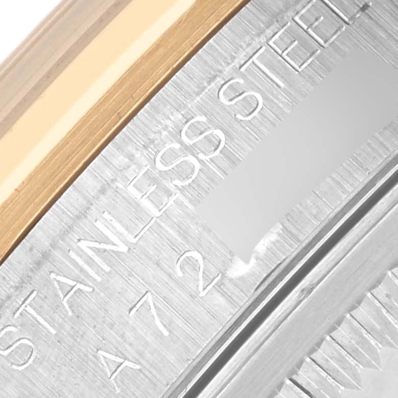 The image shows a close-up of the Rolex Datejust 16203 Men's Steel and Gold (two tone) Mother of Pearl Dial 16203 Men's Steel and Gold (two tone) Mother of Pearl Dial's stainless steel case with engraved markings.