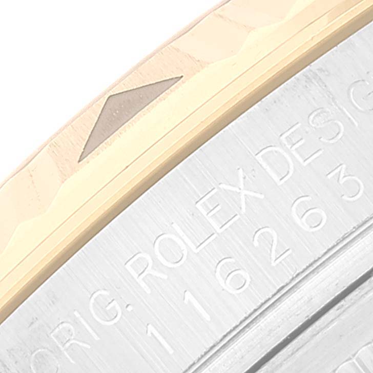 This image shows a close-up angle of the bezel and engraved case side of a Rolex Turn-o-Graph 116263 Men
s Steel and Gold (two tone) White Dial 116263 Men
s Steel and Gold (two tone) White Dial watch.