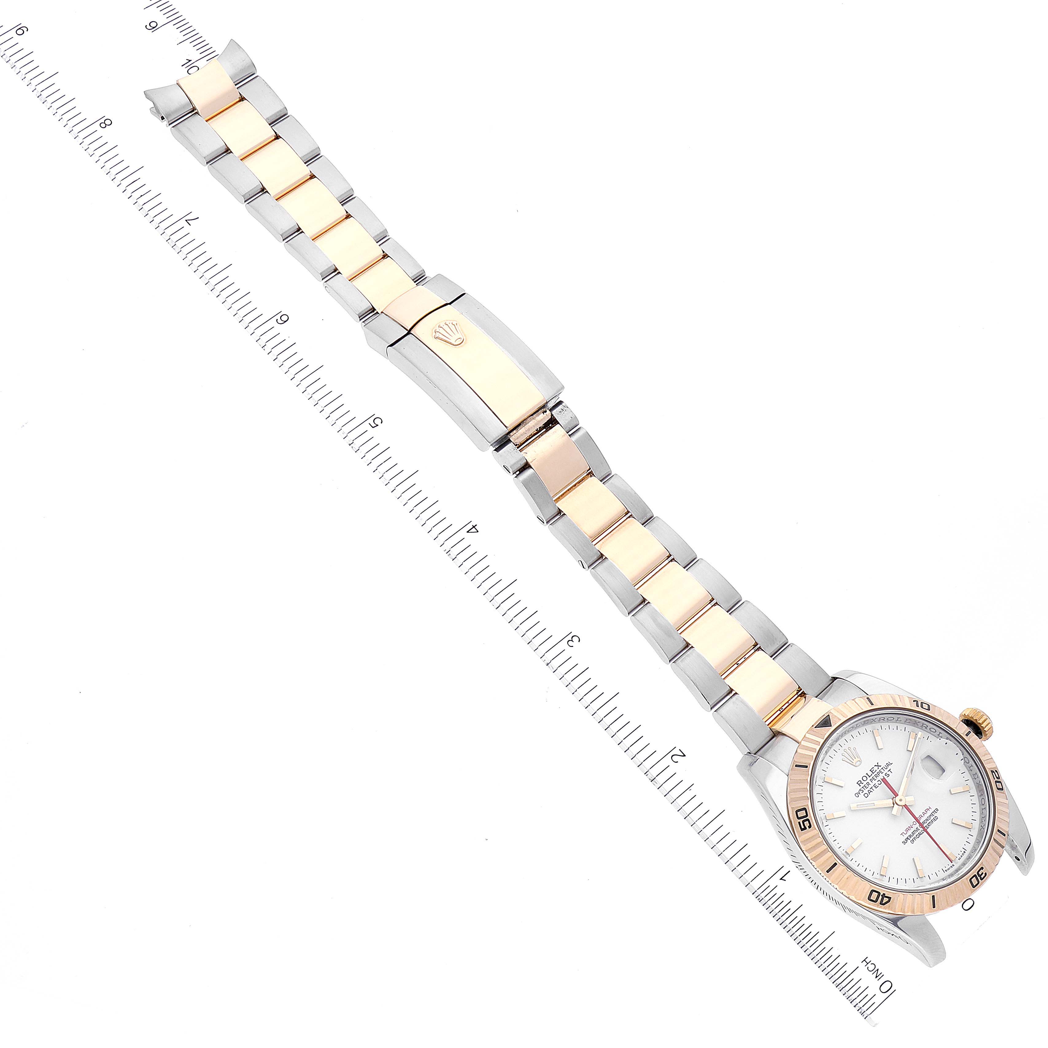 The image shows a top-down view of the Rolex Turn-o-Graph 116263 Men
s Steel and Gold (two tone) White Dial 116263 Men
s Steel and Gold (two tone) White Dial watch, including its bracelet and clasp.