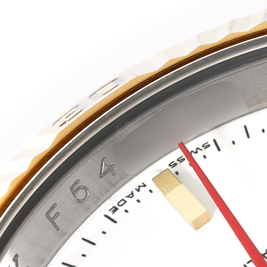 This image shows a close-up of the Rolex Turn-o-Graph 116263 Men
s Steel and Gold (two tone) White Dial 116263 Men
s Steel and Gold (two tone) White Dial watch, featuring its bezel, dial edge, and part of the red seconds hand.