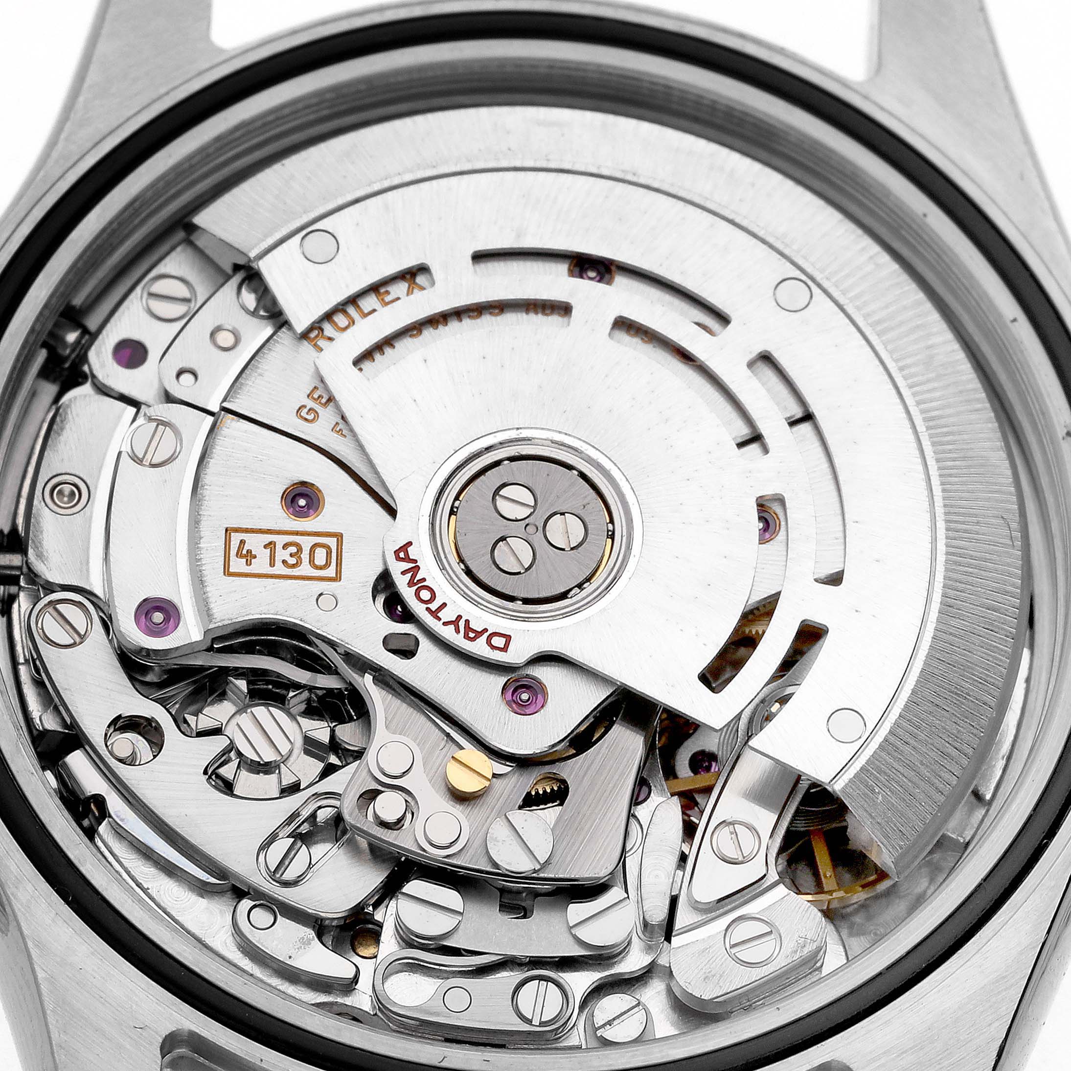 The image shows the movement of a Rolex Daytona 116520 Men's Stainless Steel White Dial 116520 Men's Stainless Steel White Dial watch, viewed from the back, highlighting its intricate mechanics.