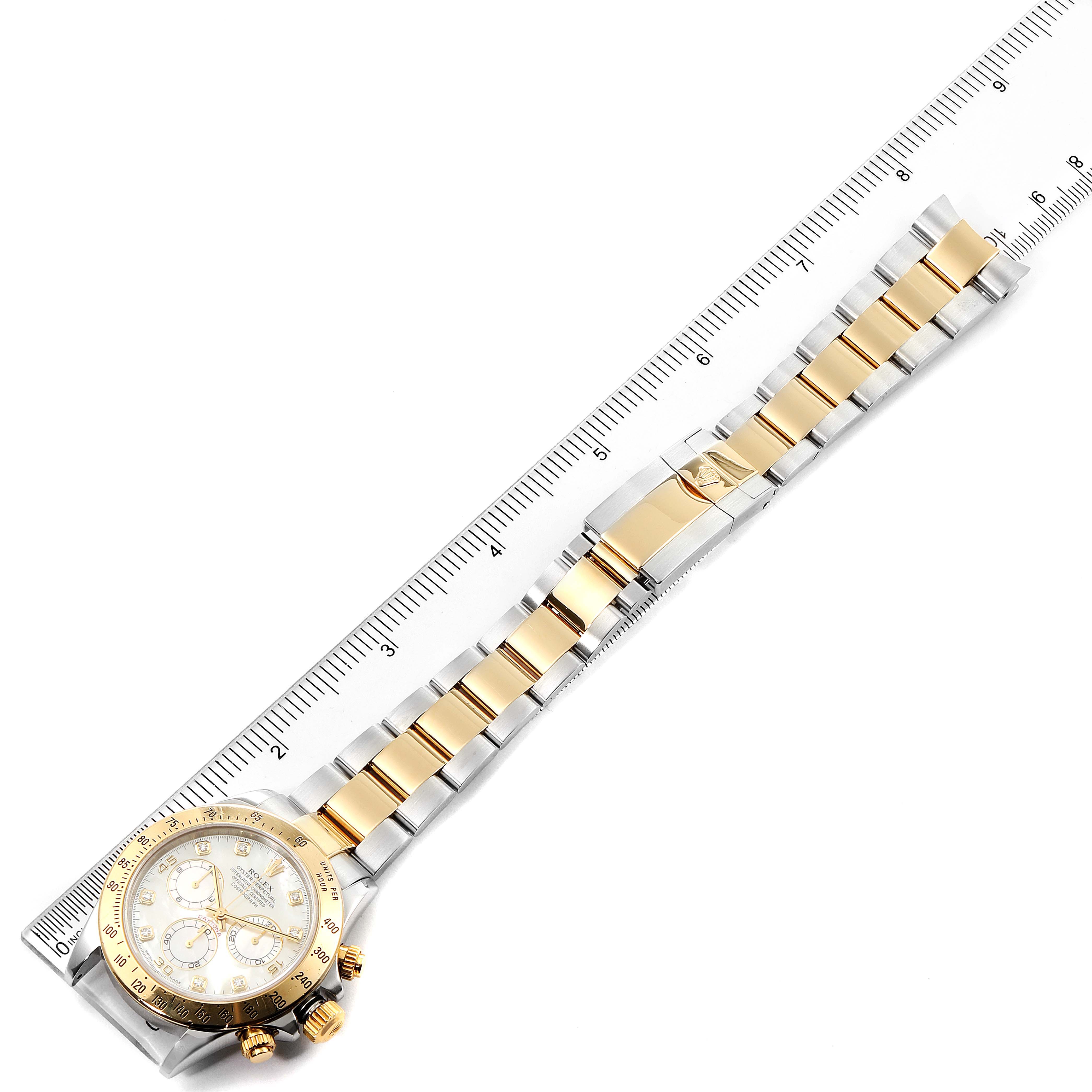 This image shows a Rolex Daytona 116523 Men's Steel and Gold (two tone) Mother of Pearl Dial 116523 Men's Steel and Gold (two tone) Mother of Pearl Dial watch angled horizontally, with its gold and silver band and dial visible.