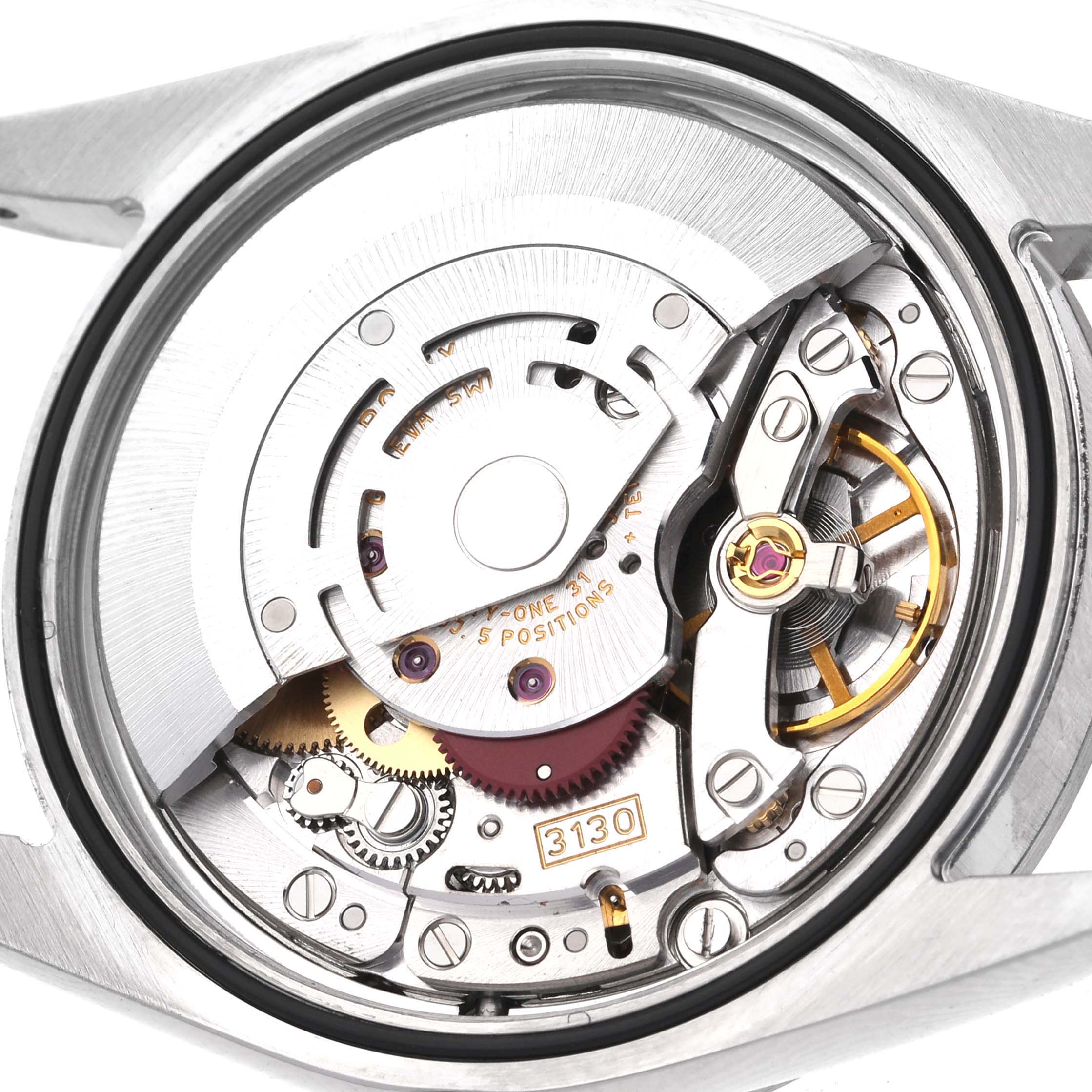 The image shows the movement of a Rolex Explorer 114270 Men
s Stainless Steel Black Dial 114270 Men
s Stainless Steel Black Dial watch, highlighting its internal mechanical parts from a back angle.