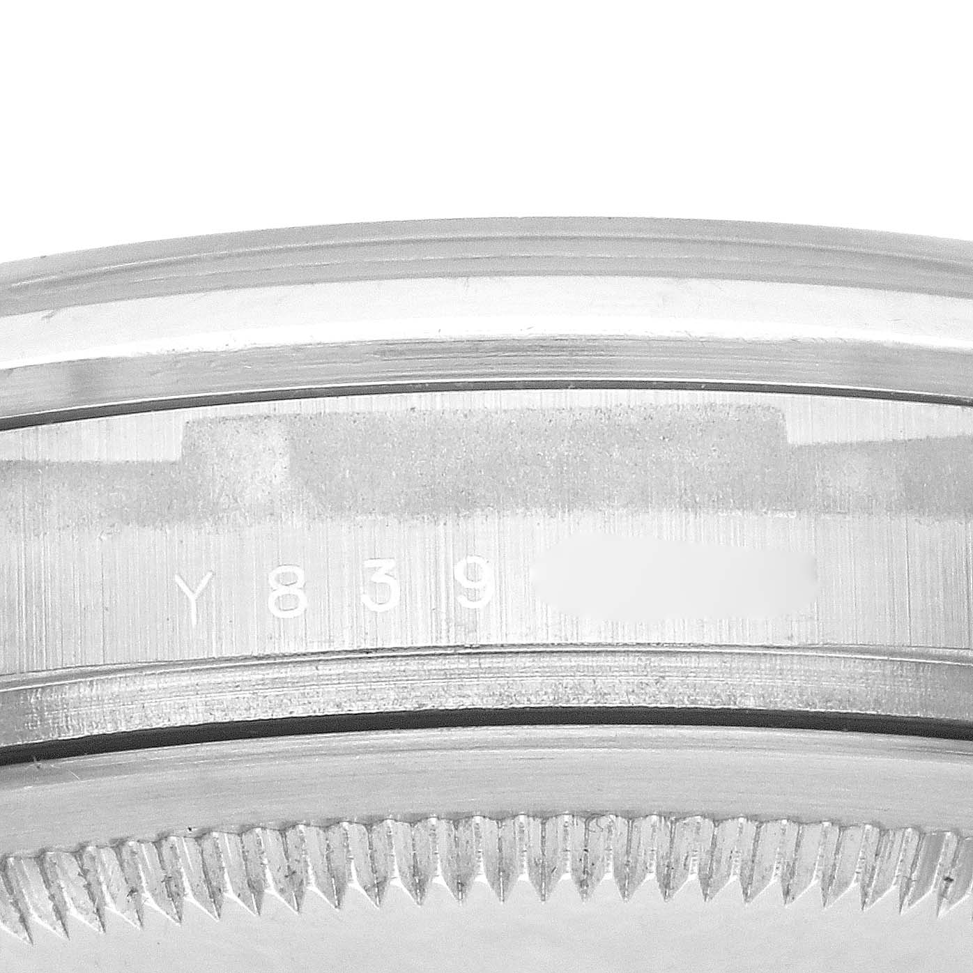 The image shows a close-up of the side casing and bezel of a Rolex Explorer 114270 Men
s Stainless Steel Black Dial 114270 Men
s Stainless Steel Black Dial watch, highlighting the serial number.