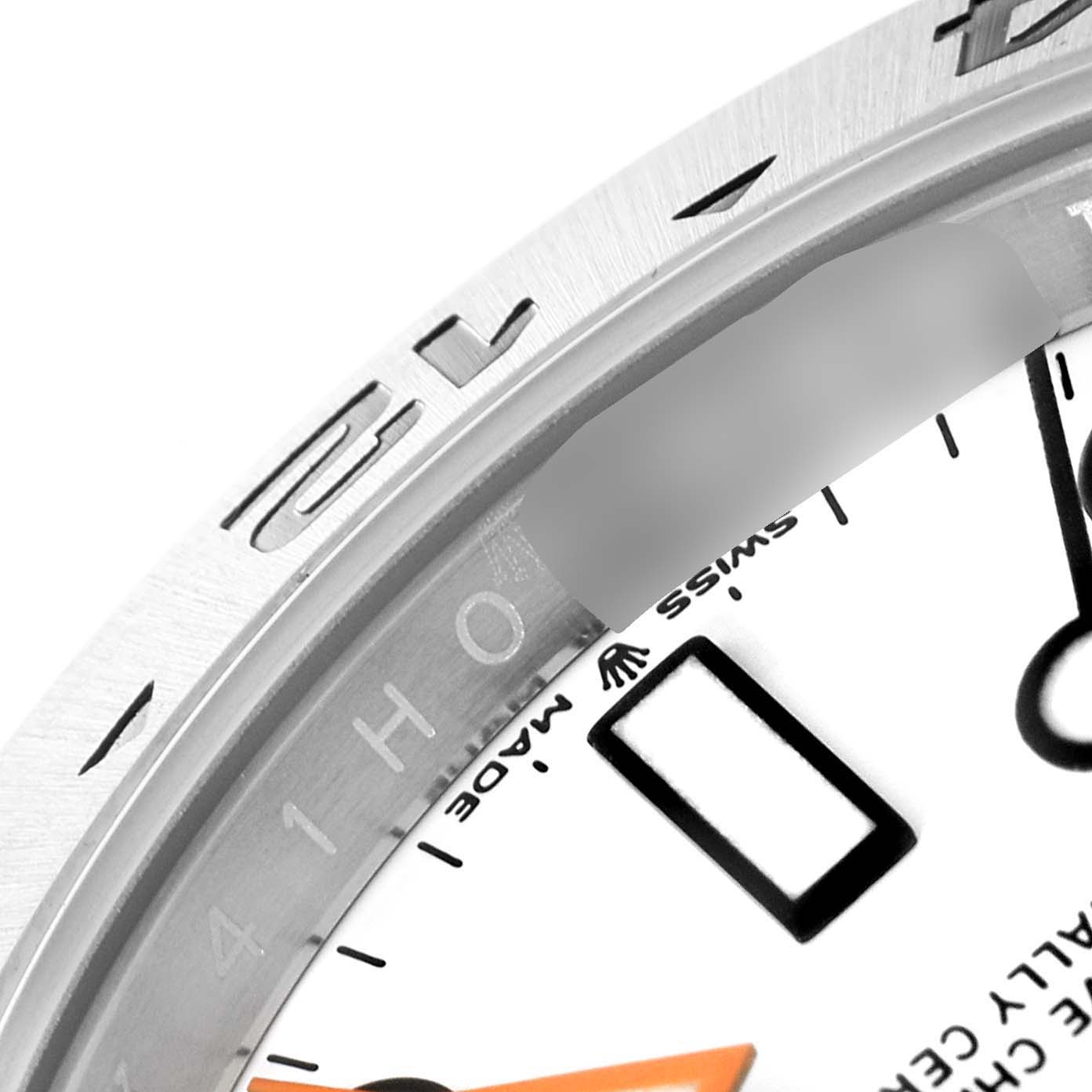 The close-up image shows part of the dial and bezel of a Rolex Explorer 226570 Men
s Stainless Steel White Dial 226570 Men
s Stainless Steel White Dial watch, featuring hour markers and brand details.