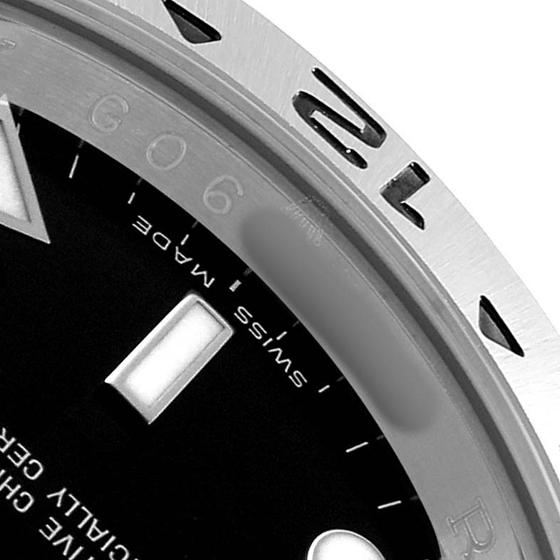 The image shows a close-up of the Rolex Explorer 16570 Men's Stainless Steel Black Dial's dial and part of the bezel, highlighting the "Swiss Made" and numerals.