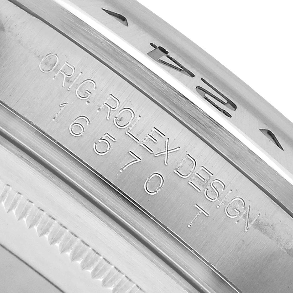 The image shows a close-up of the Rolex Explorer 16570 Men's Stainless Steel Black Dial's inner bezel with engraved model details.