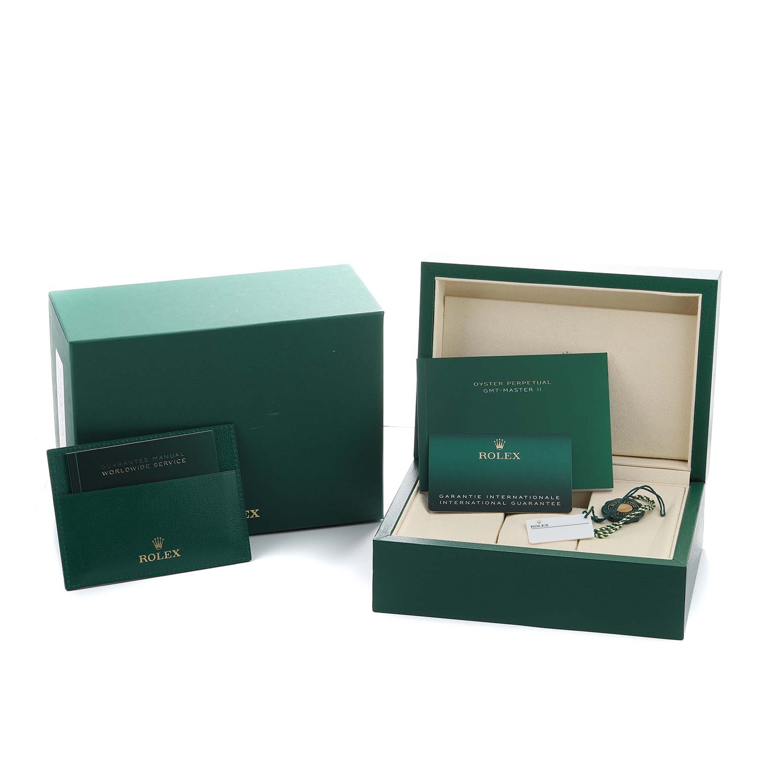 The image shows the open box and accessories for a Rolex GMT-Master 126710GRNR Men's Stainless Steel Black Dial, including booklets and tags, but not the watch itself.