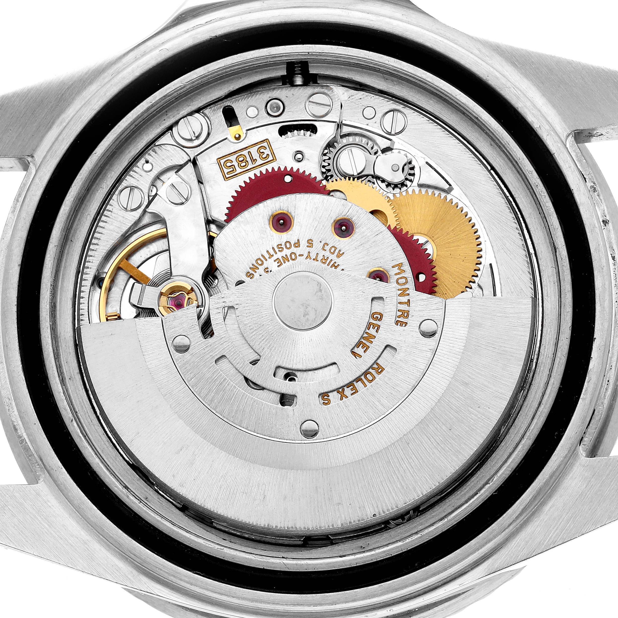 The image shows the movement of the Rolex GMT-Master 16710 Men's Stainless Steel Black Dial, highlighting gears and intricate internal mechanisms.