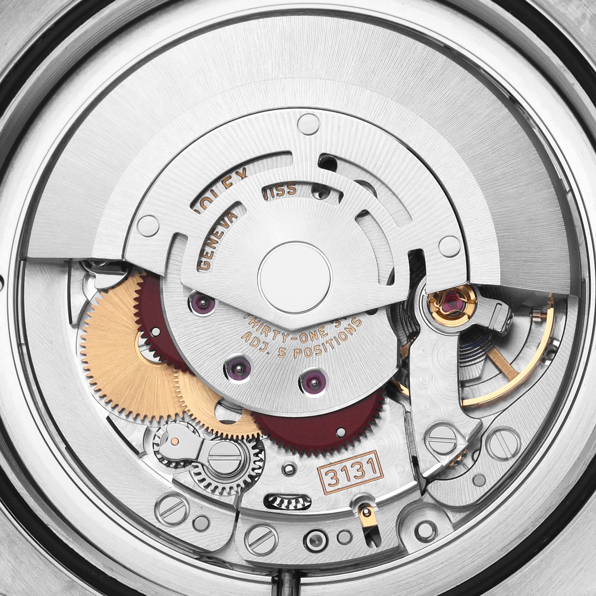 The image shows the movement of a Rolex Milgauss 116400GV Men's Stainless Steel Black Dial 116400GV Men's Stainless Steel Black Dial watch from a top-down angle, highlighting its intricate gears and components.