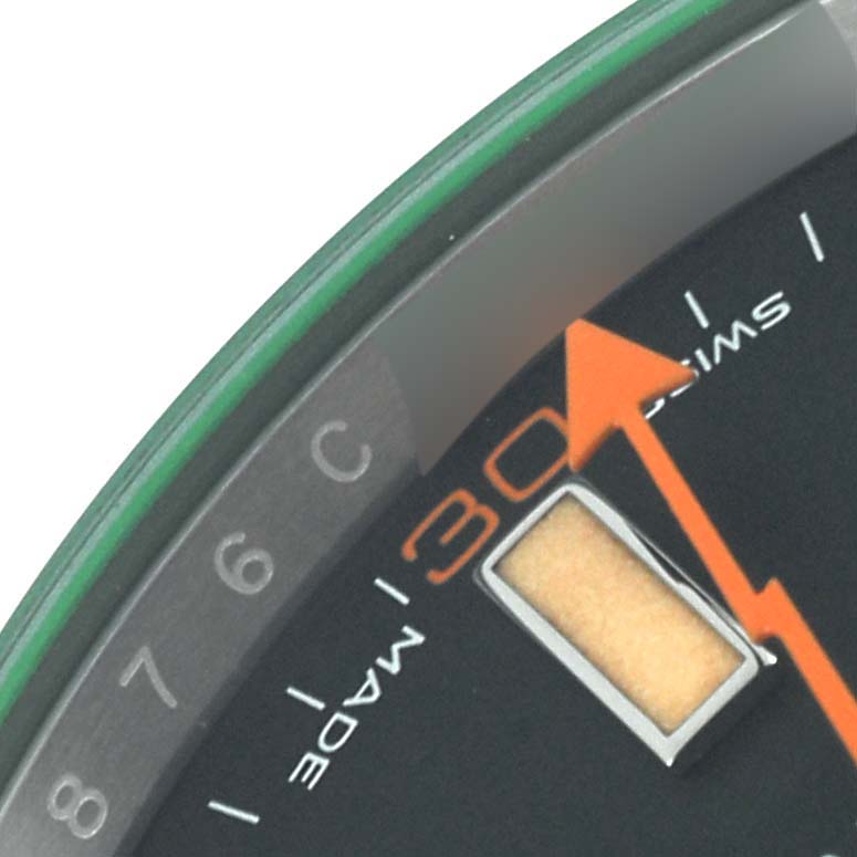 The image shows the dial and an orange lightning-bolt second hand of the Rolex Milgauss 116400GV Men's Stainless Steel Black Dial 116400GV Men's Stainless Steel Black Dial watch, highlighting the "SWISS MADE" text.