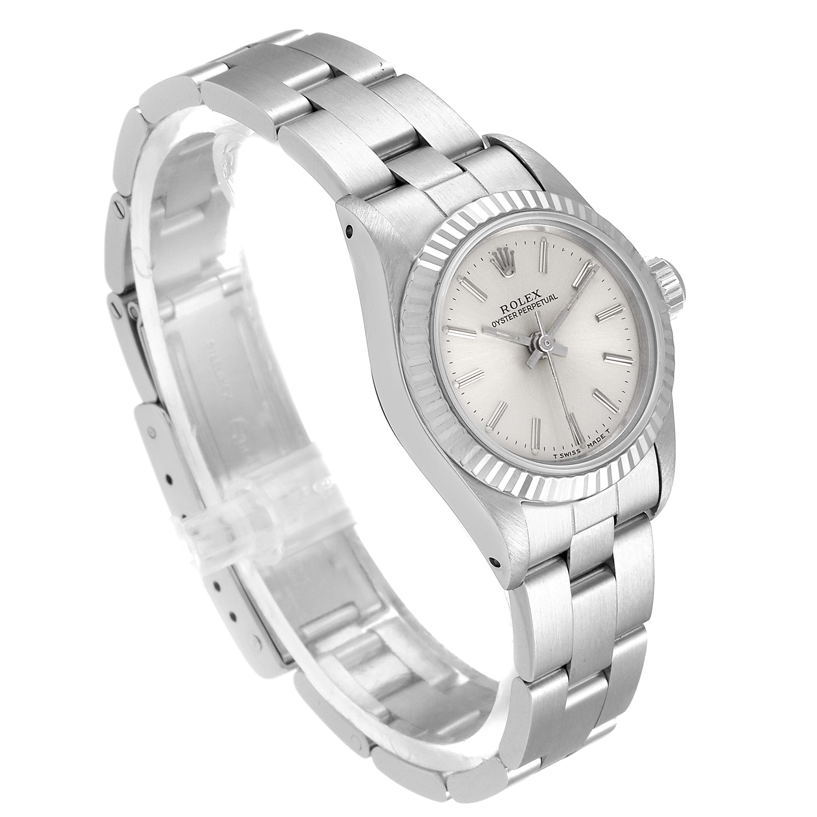 The Rolex Oyster Perpetual 67194 Women's Stainless Steel Silver Dial 67194 Women's Stainless Steel Silver Dial watch is shown from a slightly angled top-down view, displaying the face, bezel, and bracelet.