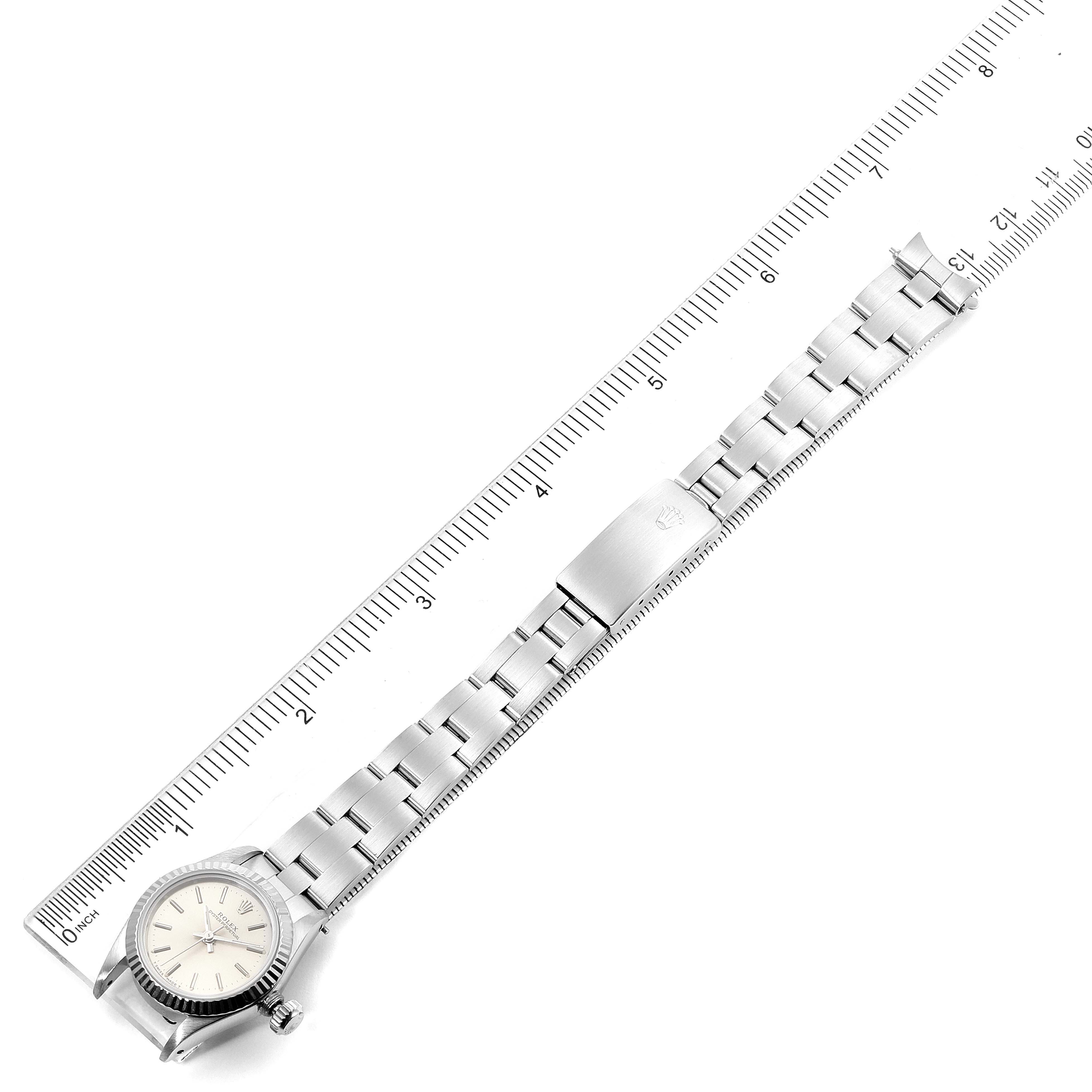 The image shows a Rolex Oyster Perpetual 67194 Women's Stainless Steel Silver Dial 67194 Women's Stainless Steel Silver Dial watch laid flat with a ruler for scale.