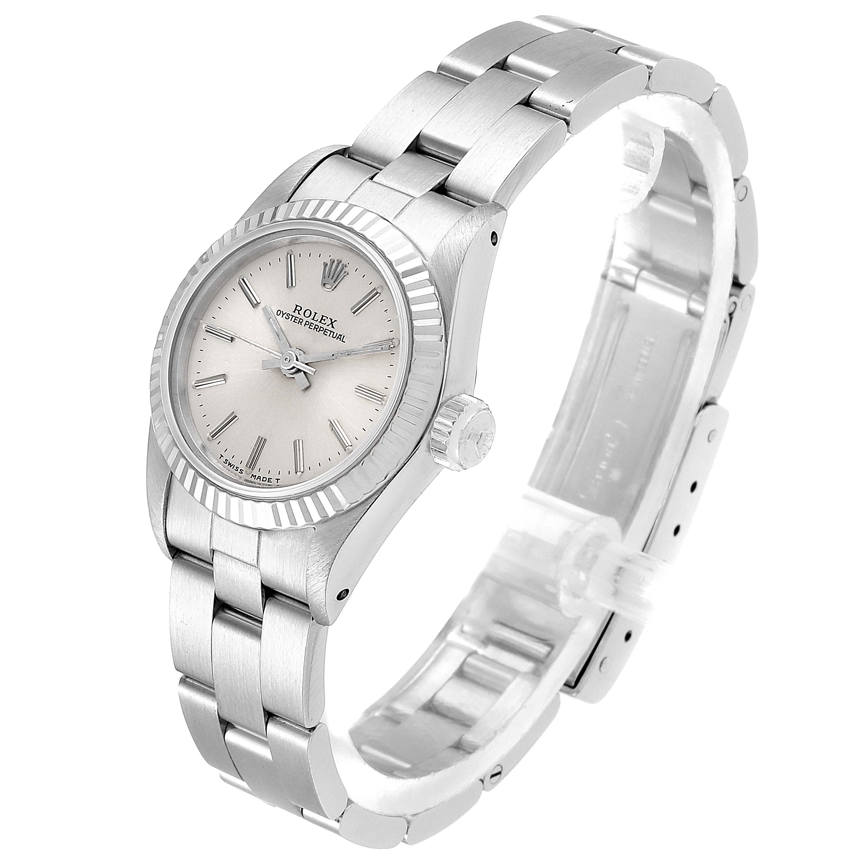 This image shows a Rolex Oyster Perpetual 67194 Women's Stainless Steel Silver Dial 67194 Women's Stainless Steel Silver Dial watch from a three-quarter angle, highlighting its face, crown, and bracelet.