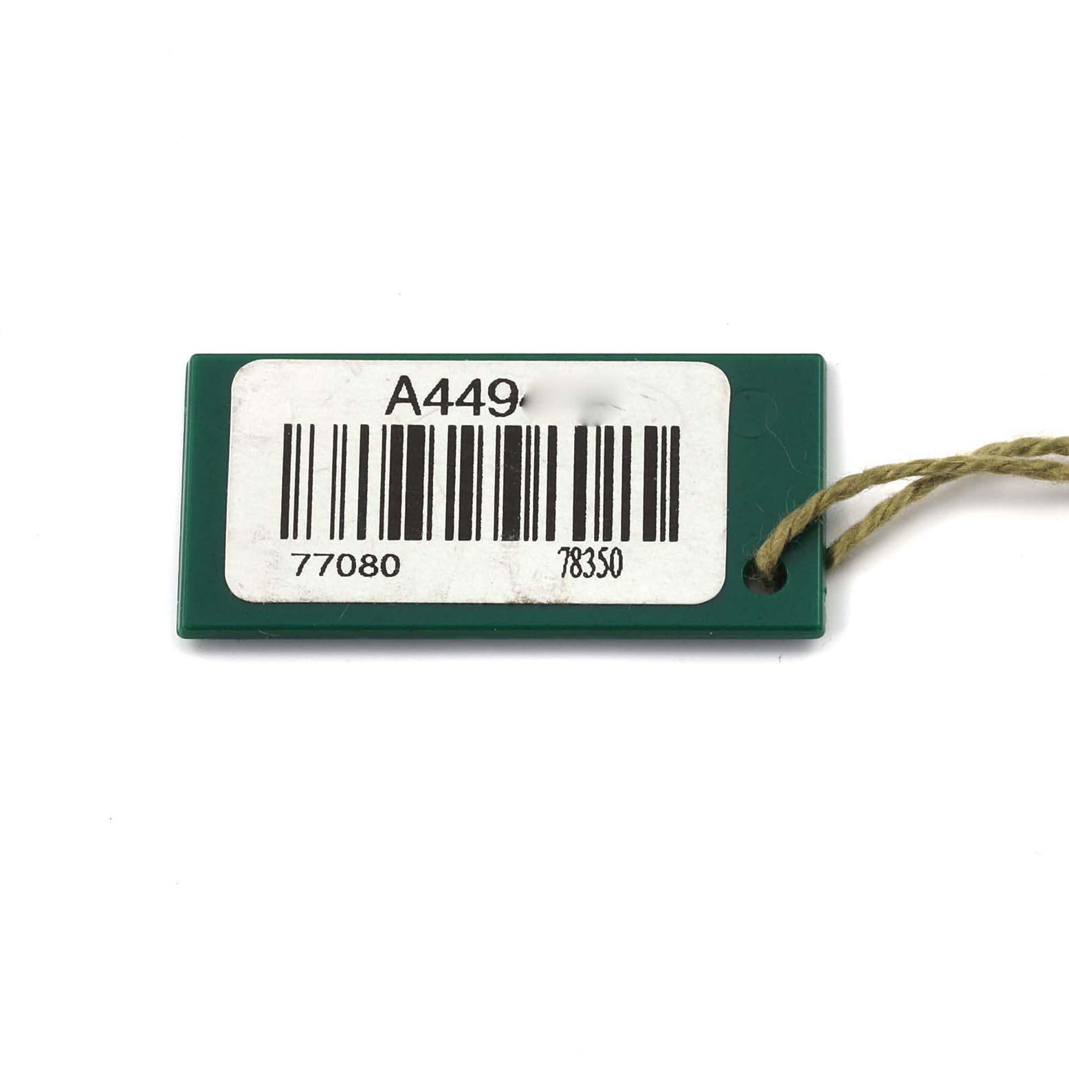 The image shows a sideways view of a Rolex Mid-Size 77080 Women's Stainless Steel Pink Dial 77080 Women's Stainless Steel Pink Dial model's green tag with barcodes and numbers.