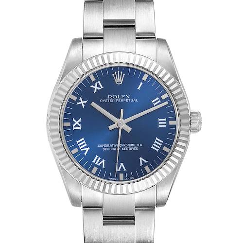 The Rolex Oyster Perpetual Mid-Size watch is shown from the front, highlighting the blue dial and stainless steel bracelet.