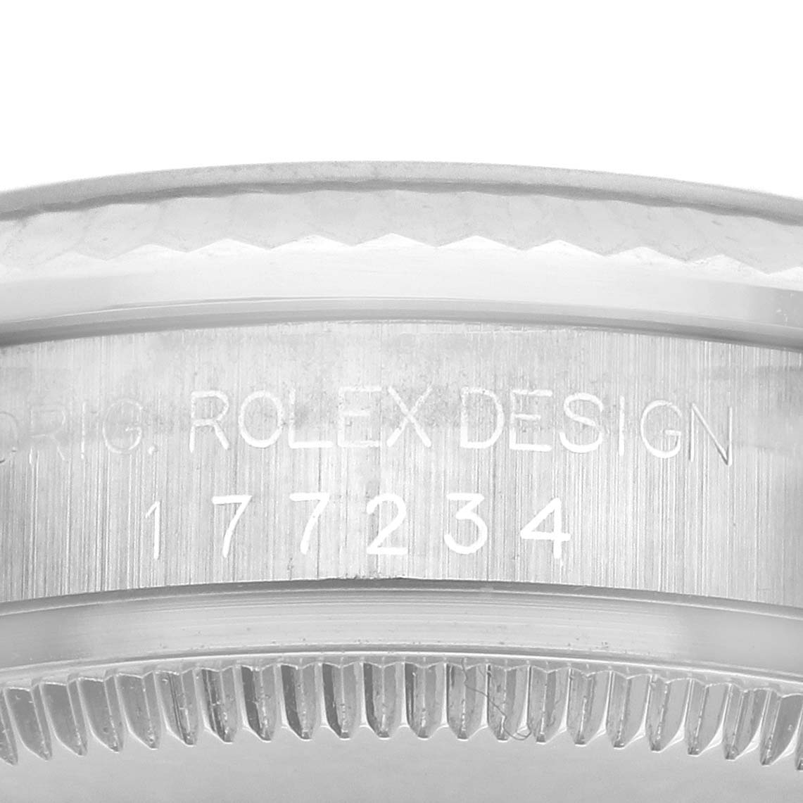 The image shows the bezel and side engraving of a Rolex Mid-Size 177234 Women
s Stainless Steel Blue Dial 177234 Women
s Stainless Steel Blue Dial watch, highlighting its design and serial number.