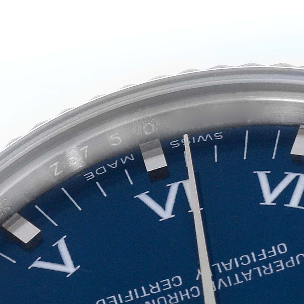 The image shows a close-up of the bezel and dial of a Mid-Size Rolex watch, highlighting the indices and "Swiss Made" text.