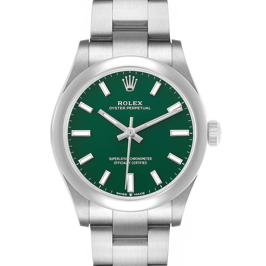 The Rolex Oyster Perpetual Mid-Size watch is shown from the front, highlighting the green dial, hands, and part of the bracelet.