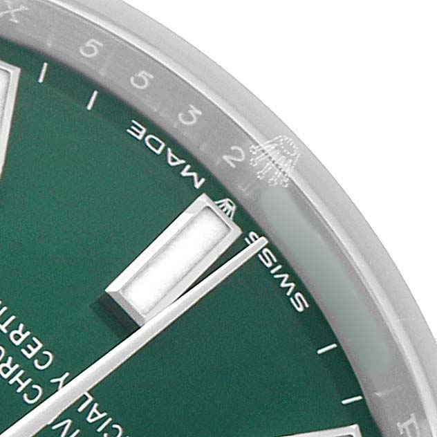 The image shows a close-up of the Rolex Mid-Size 277200 Women's Stainless Steel Green Dial watch face, focusing on the dial, markers, and part of the bezel.